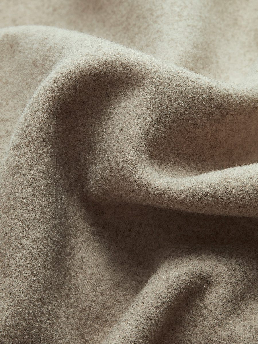 Dobbeltradet kort frakke i uldblanding til kvinder